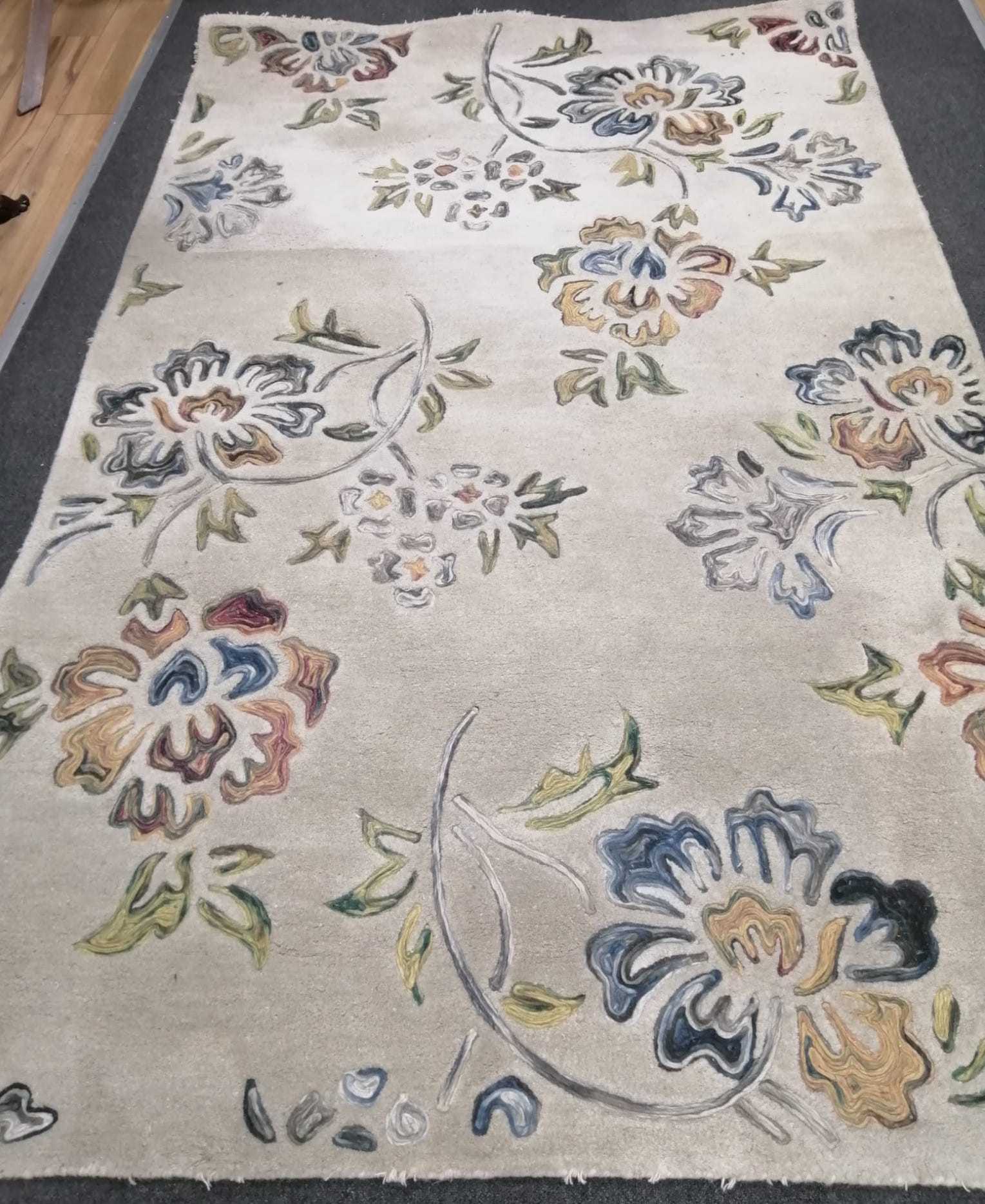 A mid century Indian decorative cream ground carpet, 244 x 154cm *Please note the sale commences at 9am.